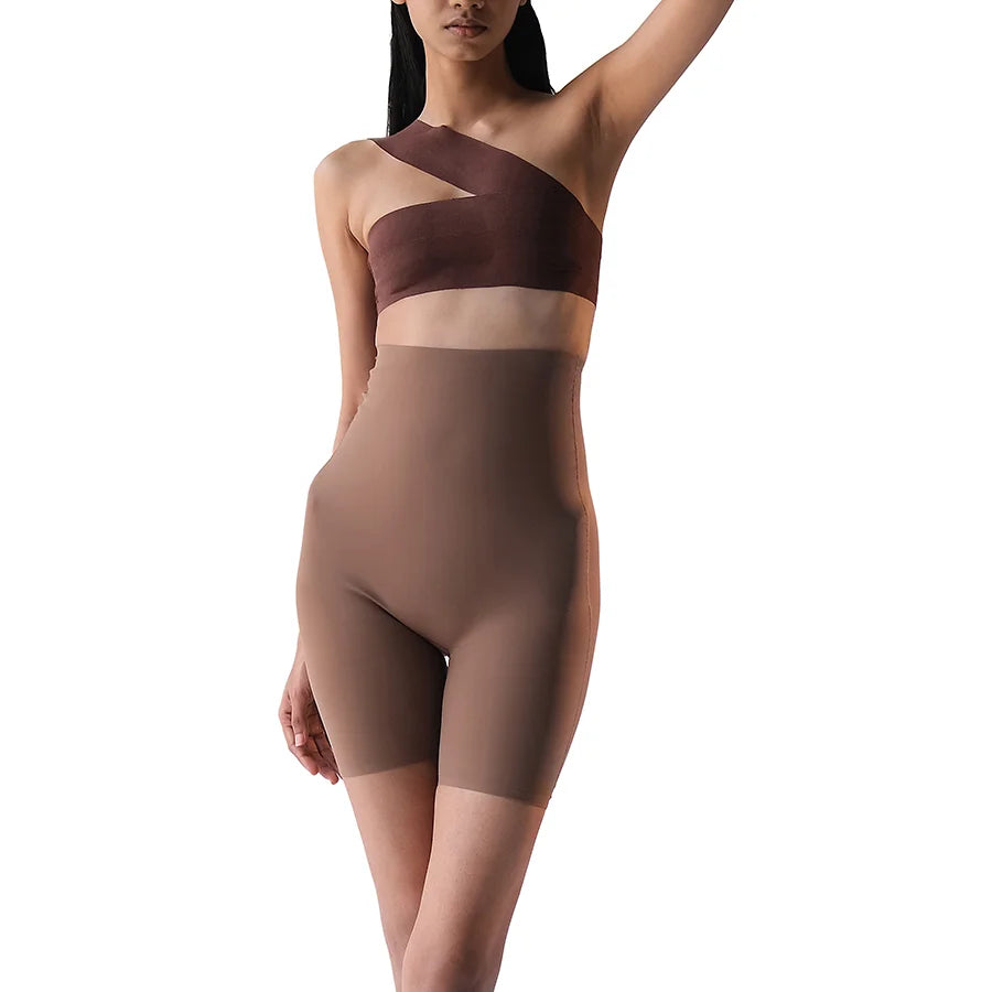 Model wearing "Shorty" shapewear in brown color.