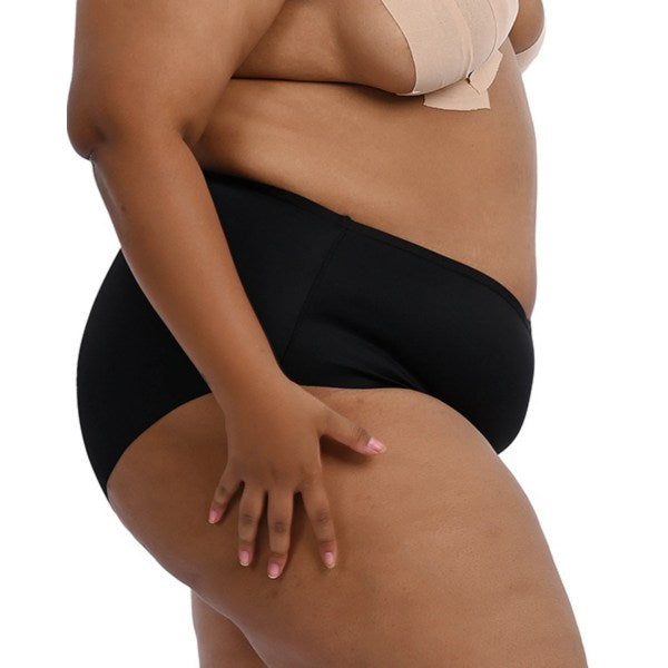 Plus-size model wearing "Cheeky" black underwear from the side.