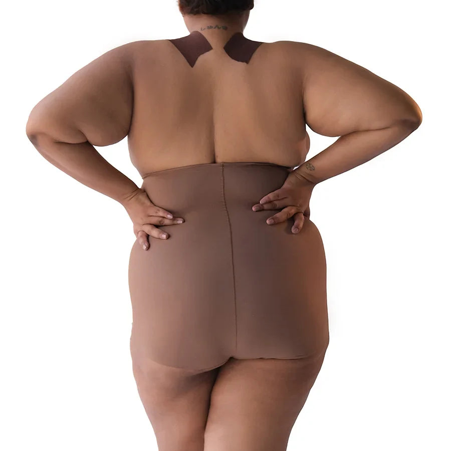 Plus-size model showcasing Super Edge shapewear from the back.