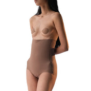 Model showcasing Super Edge seamless shapewear in beige.