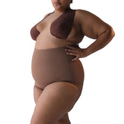 Plus-size model showcasing Super Edge shapewear for enhanced body confidence.