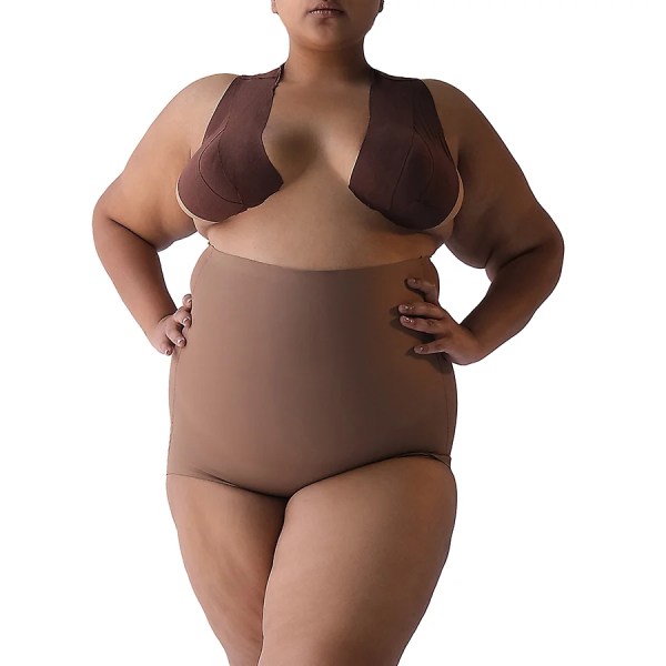 Plus-size model wearing Super Edge shapewear in neutral color.