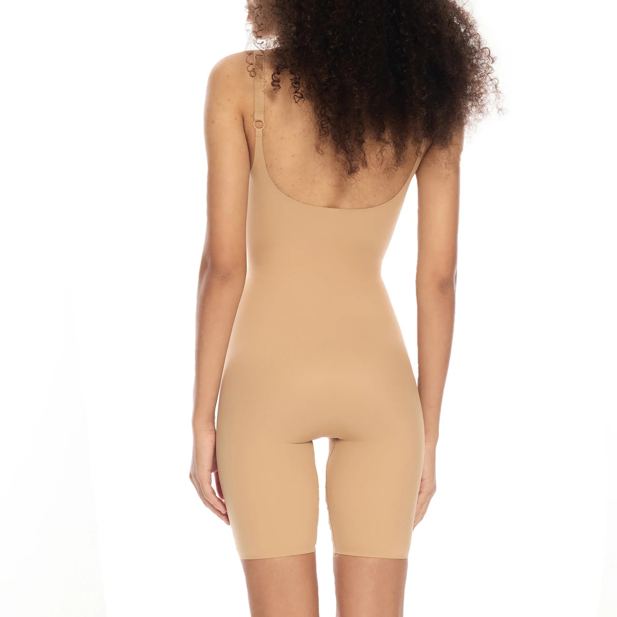 Mid-thigh bodysuit in nude color, showcasing back view and adjustable straps.