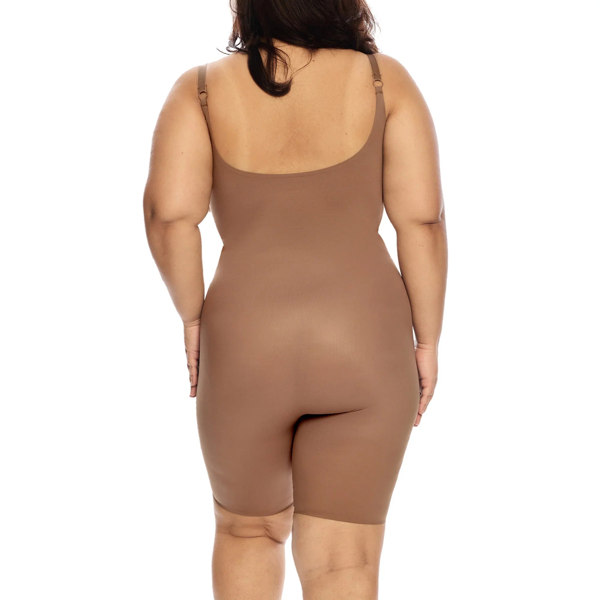 Mid-thigh bodysuit shown from the back in skin tone color.
