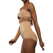 "Model showcasing Super Edge high-waisted shapewear in nude color."