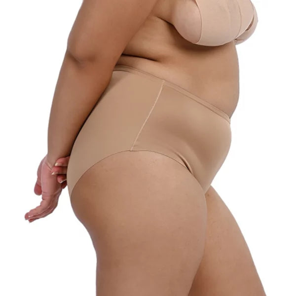 Curvy model wearing Cheeky nude high-waisted panties from the side.