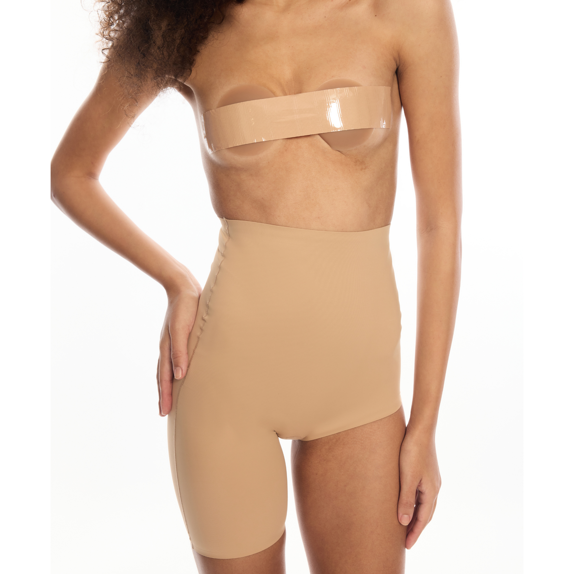 Right Leg Shorty body shaper in nude color on model.