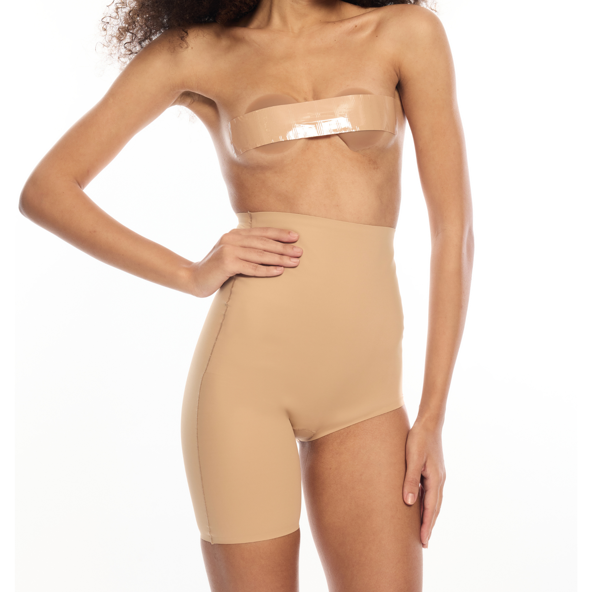Model wearing Right Leg Shorty shapewear in nude color.